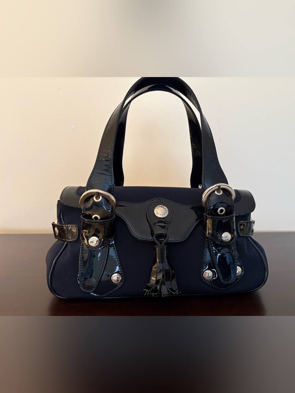 Stuart Weizman Navy Patent Trim Women's Satchel Handbag, leather tassel.